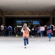 group of student walking into school building