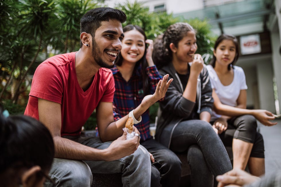 group of students joking and getting to know each other