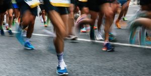 group of unknown people running marathon, defocused sports background