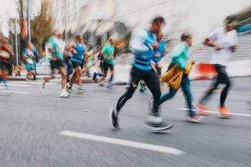 group of unknown people running Mafate marathon distance at the city street