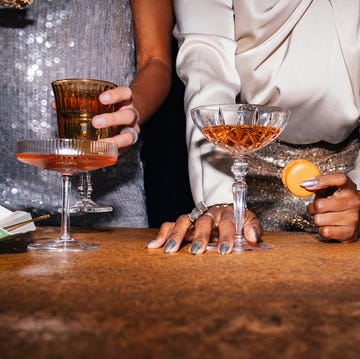 Group of Unrecognizable People Snacking and Drinking at a Fancy Party group of unrecognizable people snacking and drinking at a fancy party