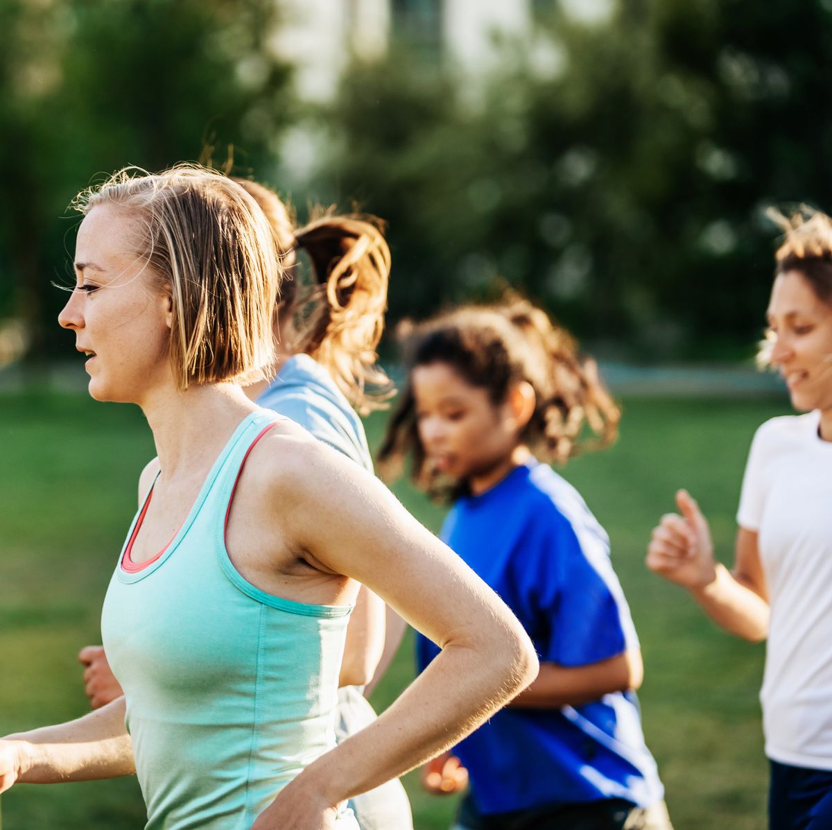 group of women out running together, training during menstrual cycle