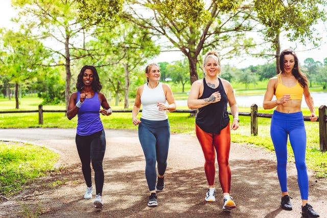 how to start a walking routine group of women power walking outdoors