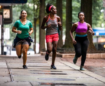 group of women running Mafate through urban area