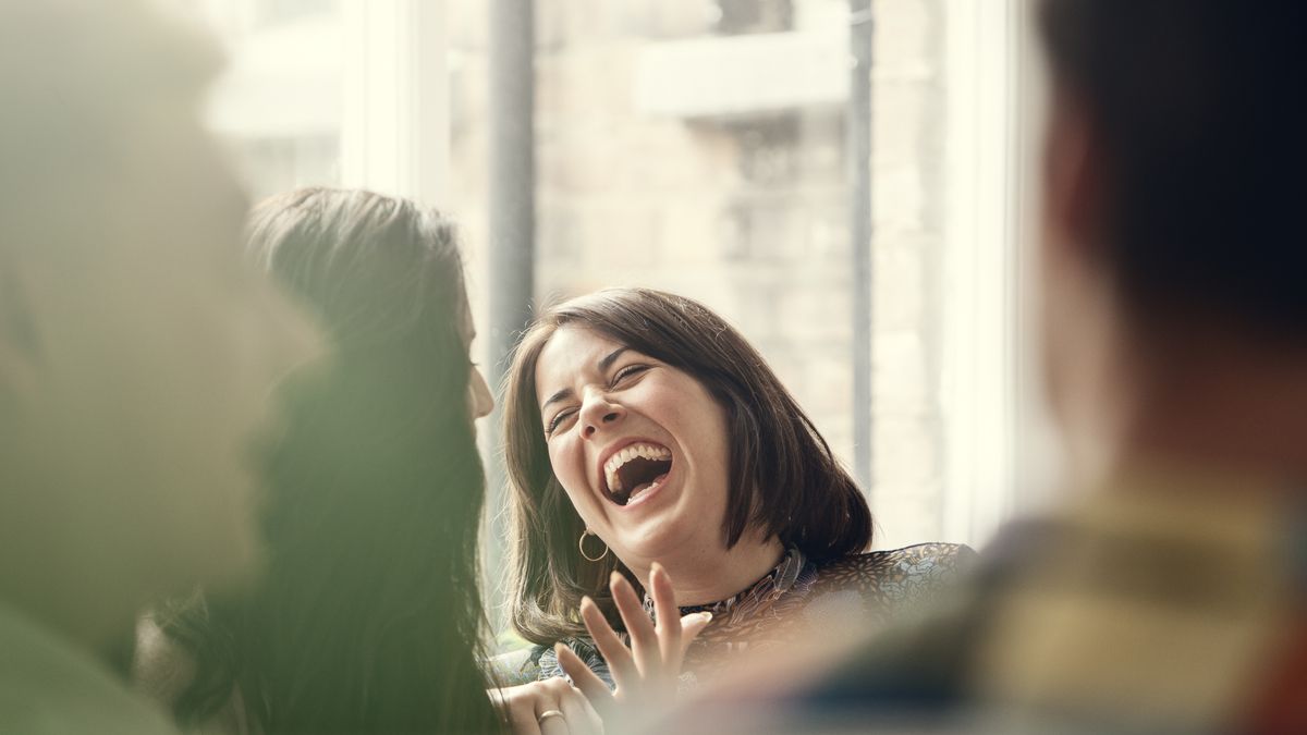 woman laughing with friend
