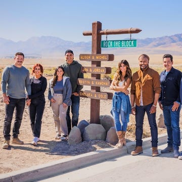 group of individuals gathered near a directional sign group of individuals gathered near a directional sign