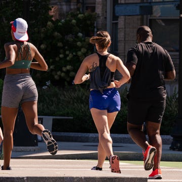 group of runners on city street group of runners on city street