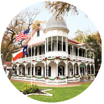 gruene mansion inn in texas, christmas garlands on porch railings