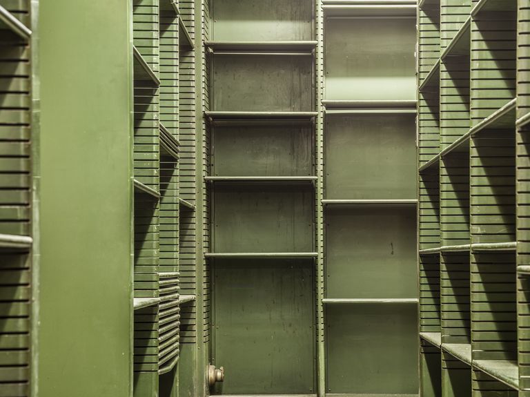 old empty green shelves in a library usa