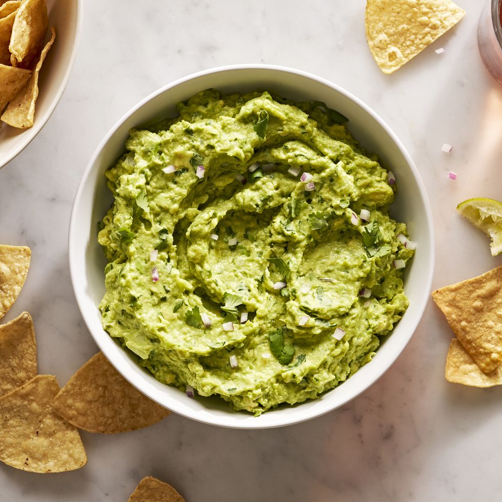 guacamole with diced red onion, cilantro, and with chips