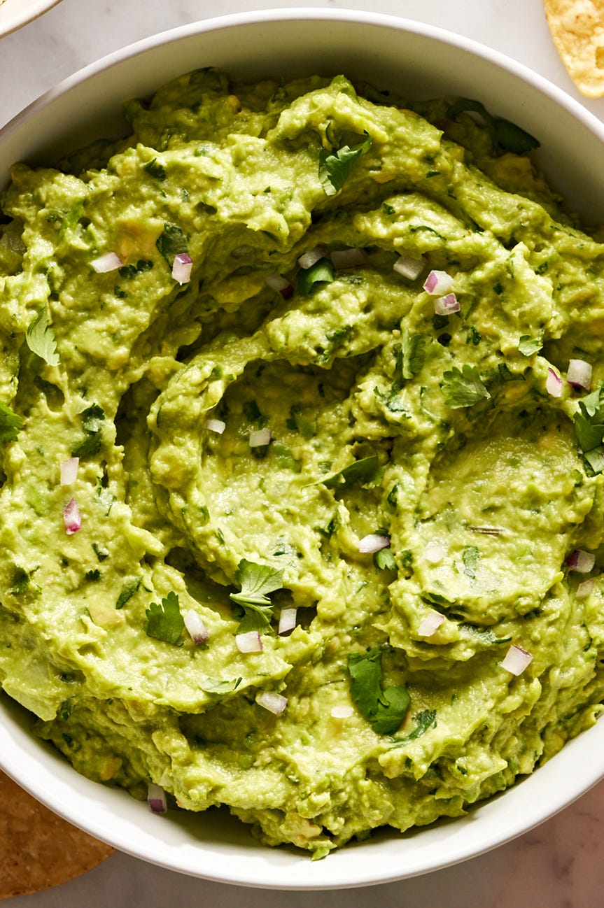 guacamole with diced red onion, cilantro, and with chips