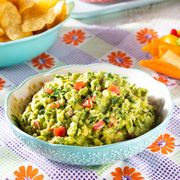 guacamole recipe with tortilla chips and fresh veggies