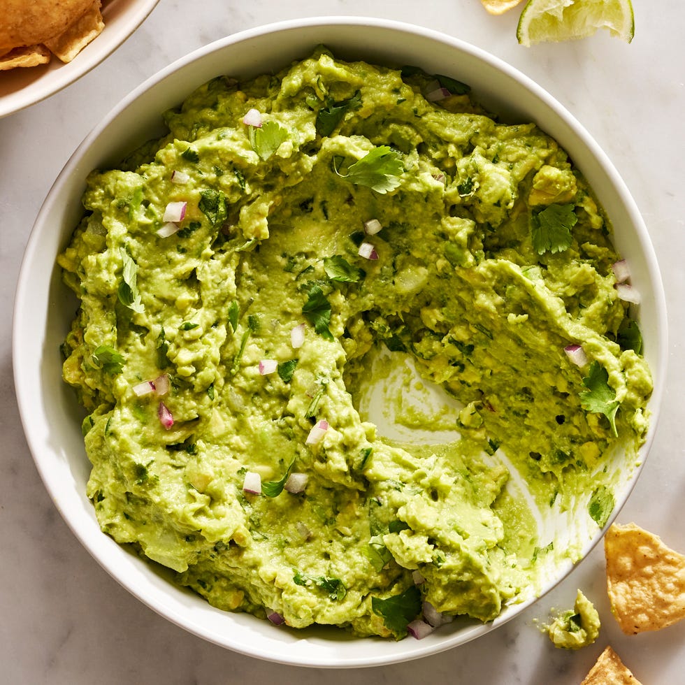 guacamole with diced red onion, cilantro, and with chips