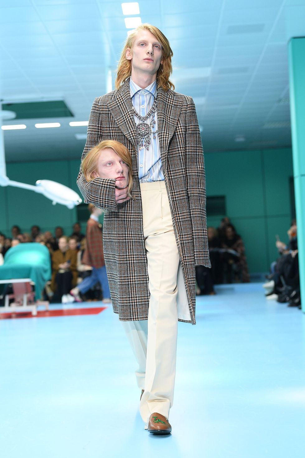 Gucci show features models carrying severed heads