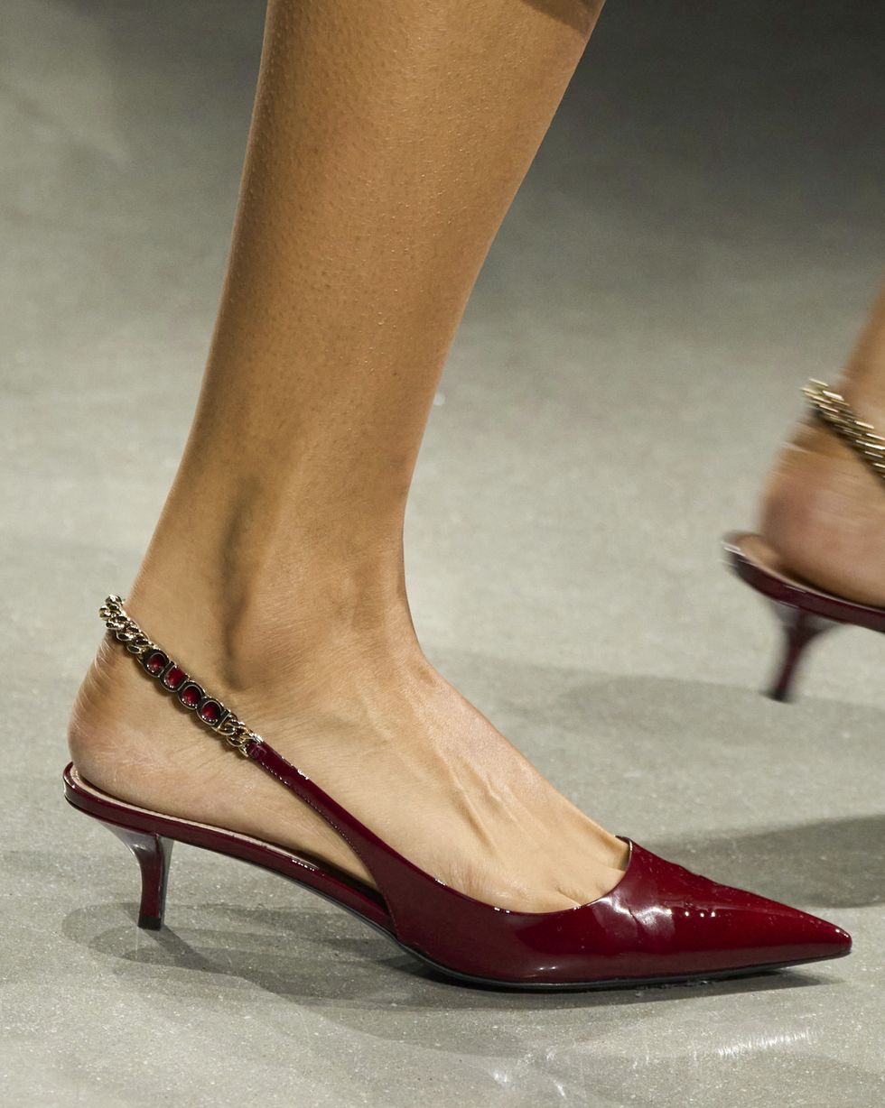 a person wearing red heels