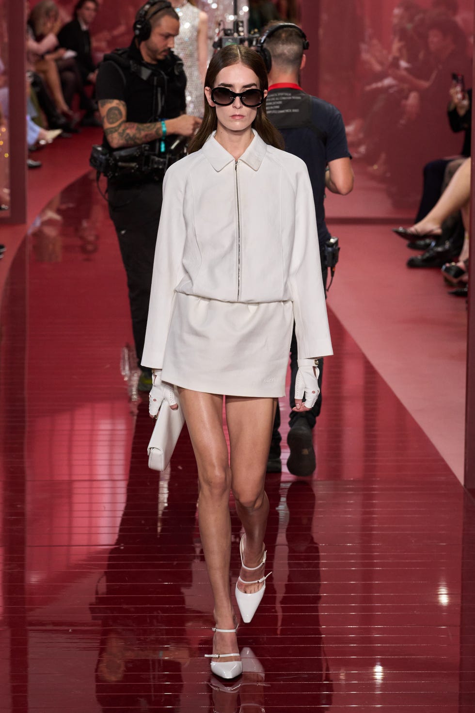 a model walks the runway during a fashion show