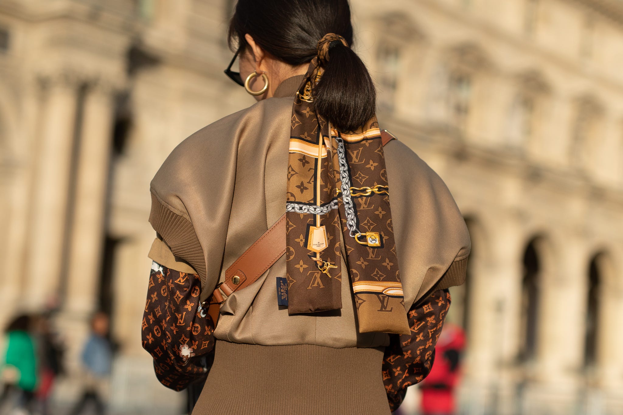 A guest is seen on the street attending LOUIS VUITTON during Paris