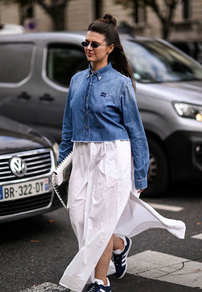 Street Style Todas Las Zapatillas Que Son Tendencia   Guest Is Seen Wearing A Blue Miu Miu Denim Shirt White News Photo 1696666176 