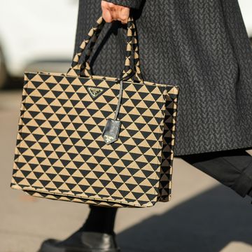prada bag street style shot during paris fashion week for best laptop bags round up
