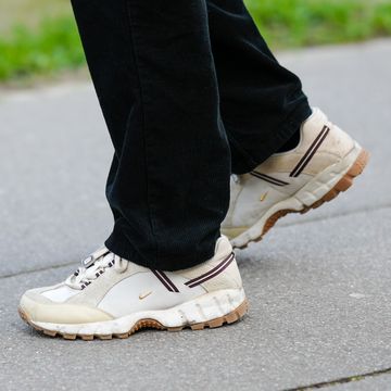 a person at paris fashion week wearing nike jacquemus sneakers in a roundup of the best cool sneakers