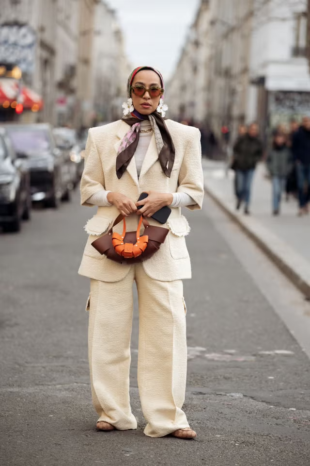 fashionable individual in a street setting donning a stylish outfit