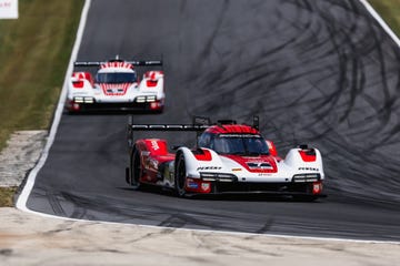 the no 7 porsche penske leading the no 6 earlier in the race