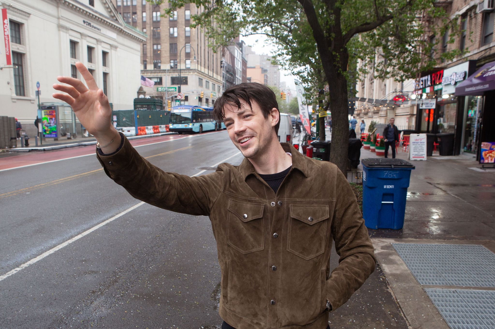 grant gustin hailing a cab in new york