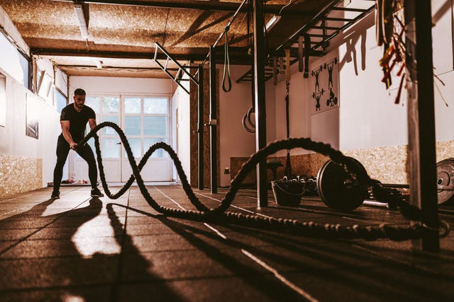 Guy exercising in the cross training facility