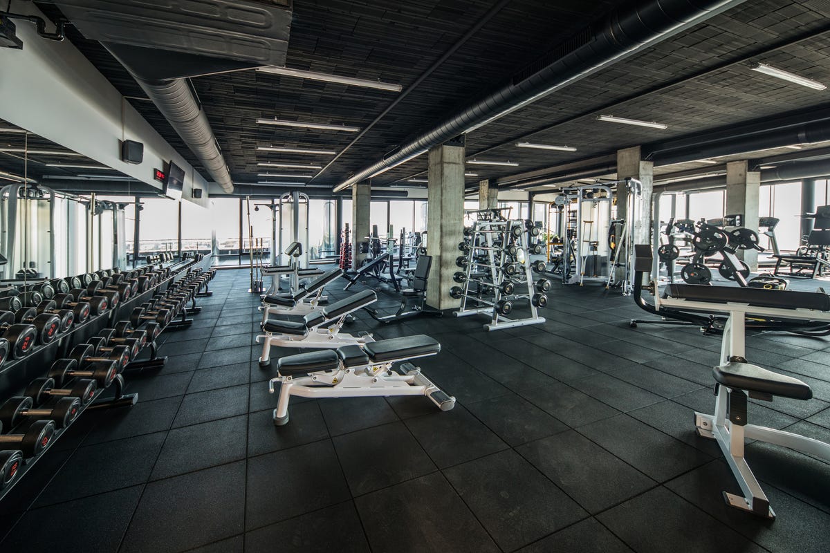 [Image: gym-without-people-with-large-group-of-e...ize=1200:*]