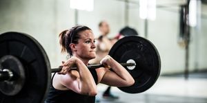 gym   woman doing front squats