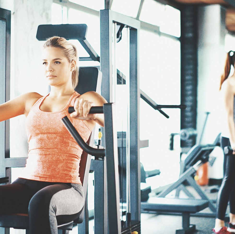 Fitness Woman Workout on Chest Press Machine in Sport Club, Stock Footage