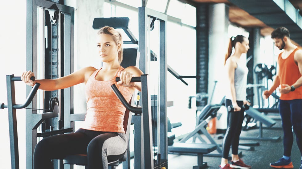 Fitness Woman Workout on Chest Press Machine in Sport Club, Stock Footage