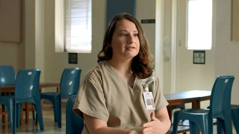 a woman sitting in a classroom