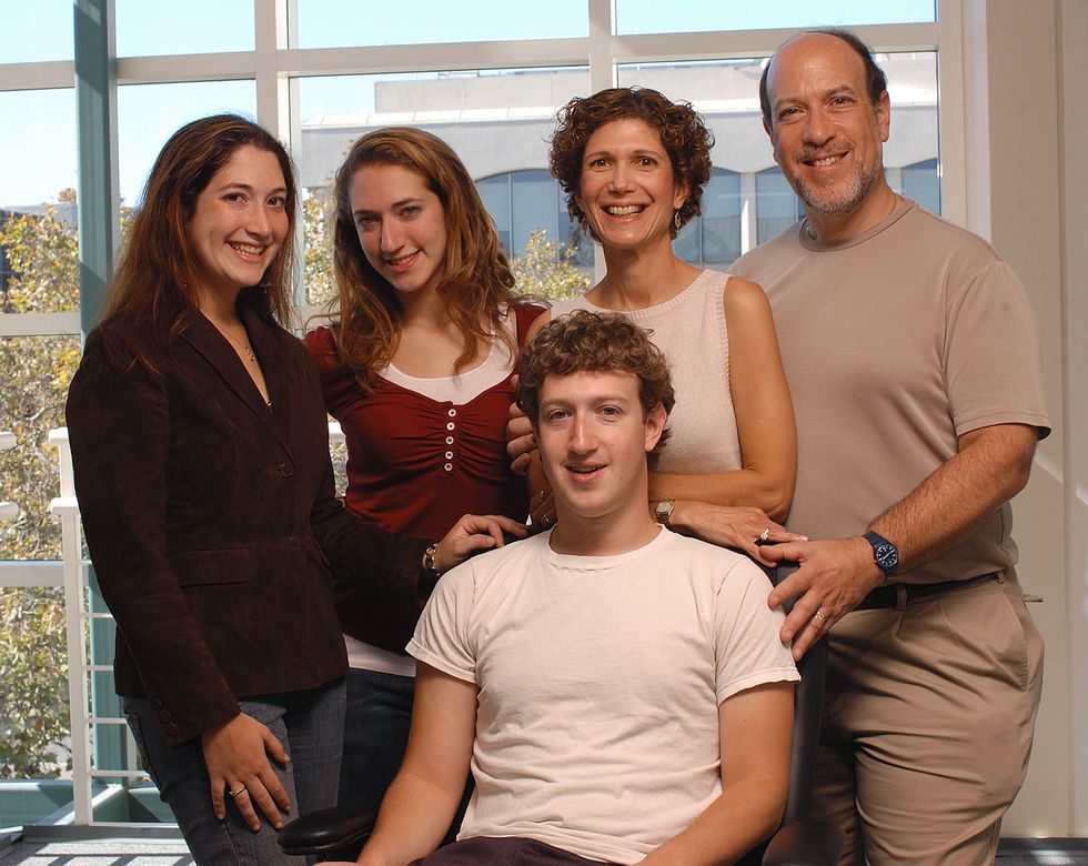 Mark Zuckerberg of Facebook, seated, with his family at the Palo Alto office of Facebook in 2005.