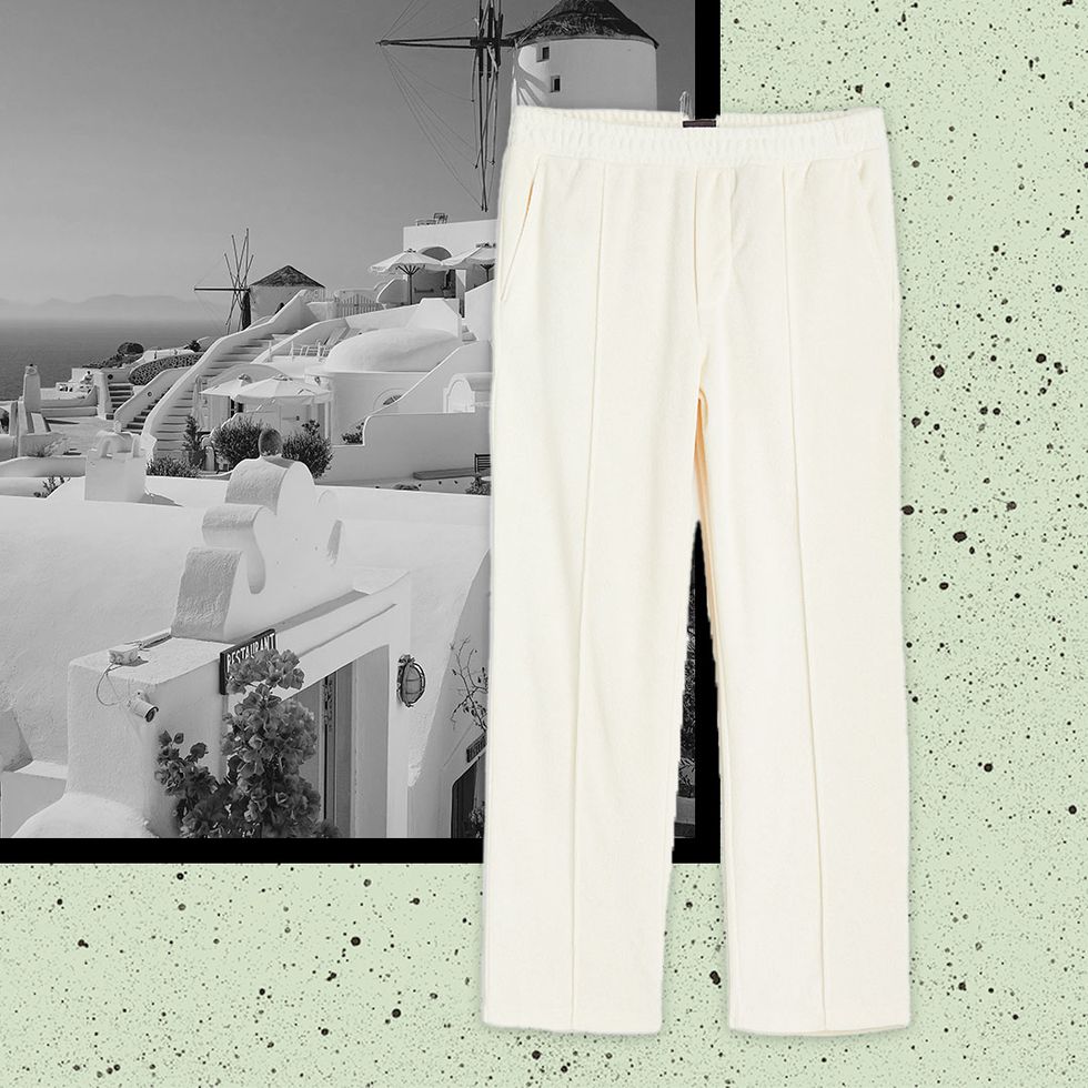 cream linen pleated trousers against an image of a black and white island