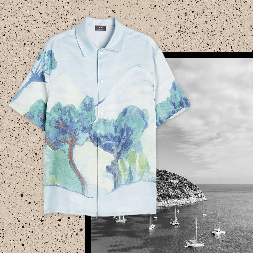 printed blue shirt with trees on against a black and white image of an island