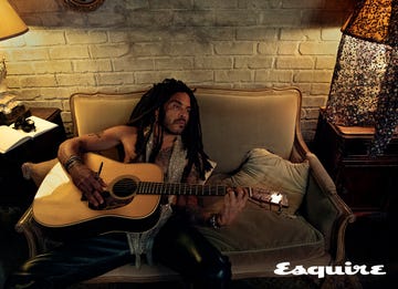 lenny kravitz playing a guitar