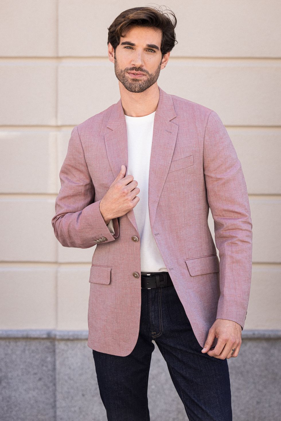 a man in a pink suit