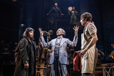 Noblezada (Eurydice), Hermes (André de Shields), and Reeve Carney (Orpheus) in Hadestown