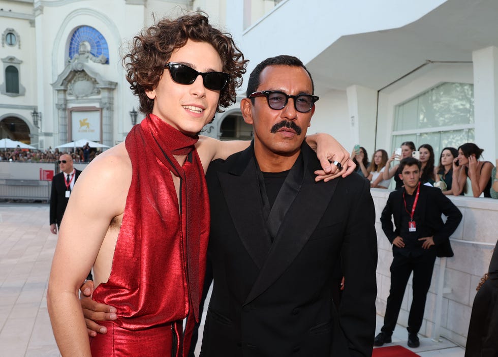 venice, italy september 02 timothee chalamet l poses with designer haider ackermann