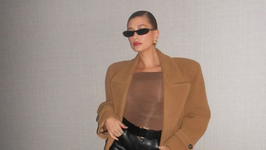 See Hailey Bieber Pair a Leather Coat with a Tiny Skirt and Tights
