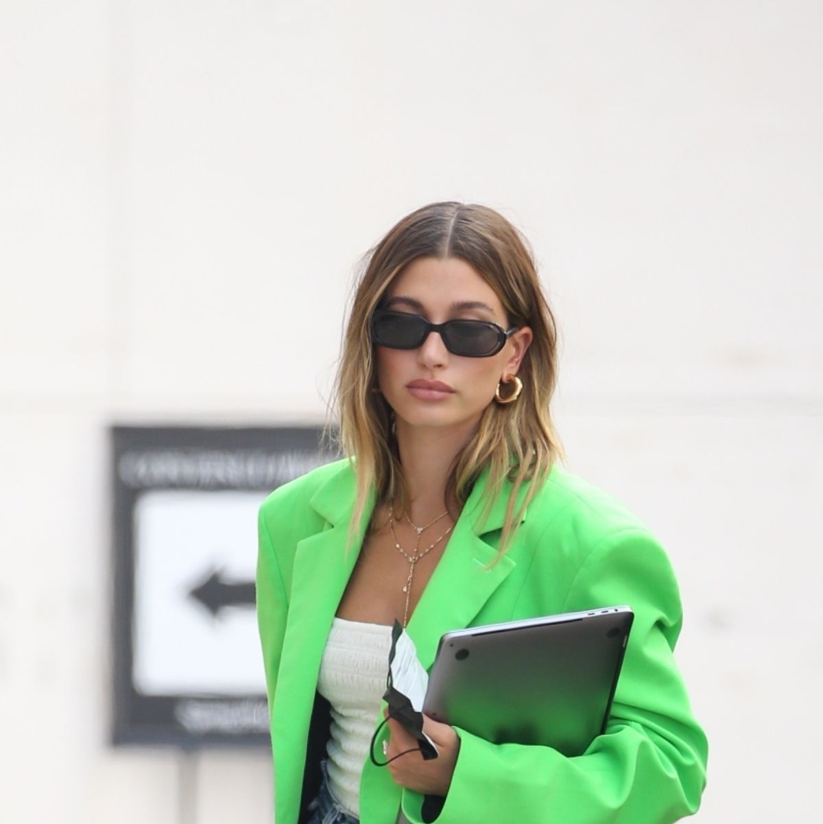 Hailey Bieber heads to a meeting in a neon green Prada crop top and  matching Bottega Veneta bag in Beverly Hills, California-140823_5