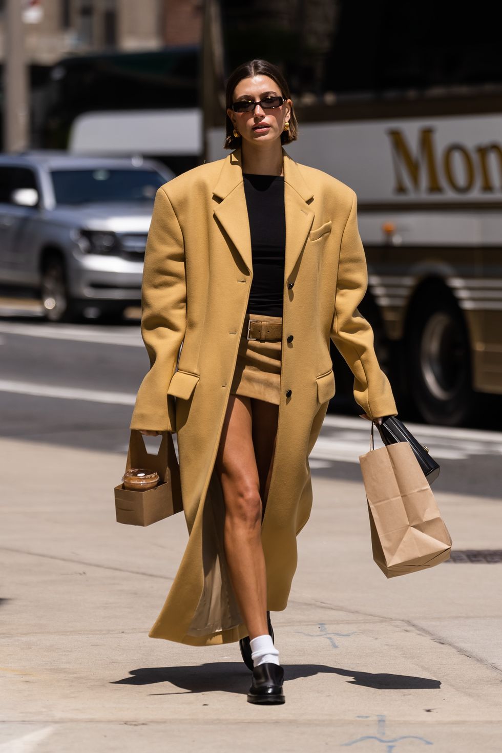 Hailey Bieber Wore Short Miniskirt and Open Long Coat in NYC
