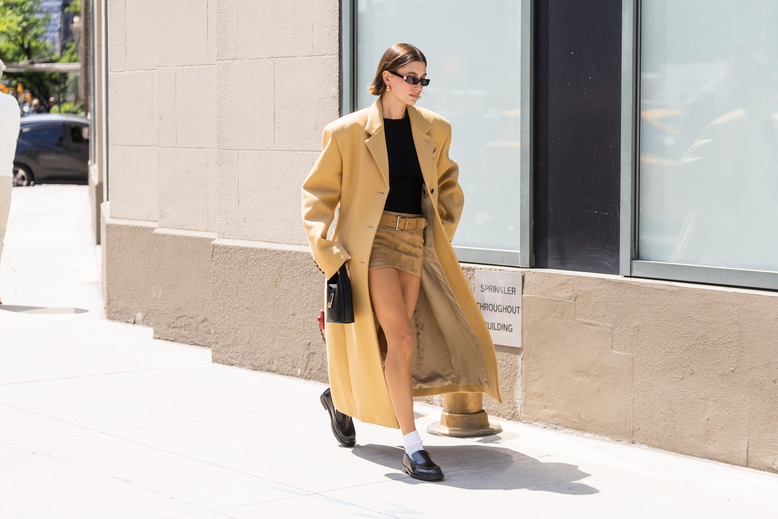 Style Notes: Irina Shayk's lesson in trans-seasonal dressing with two  stylish coats