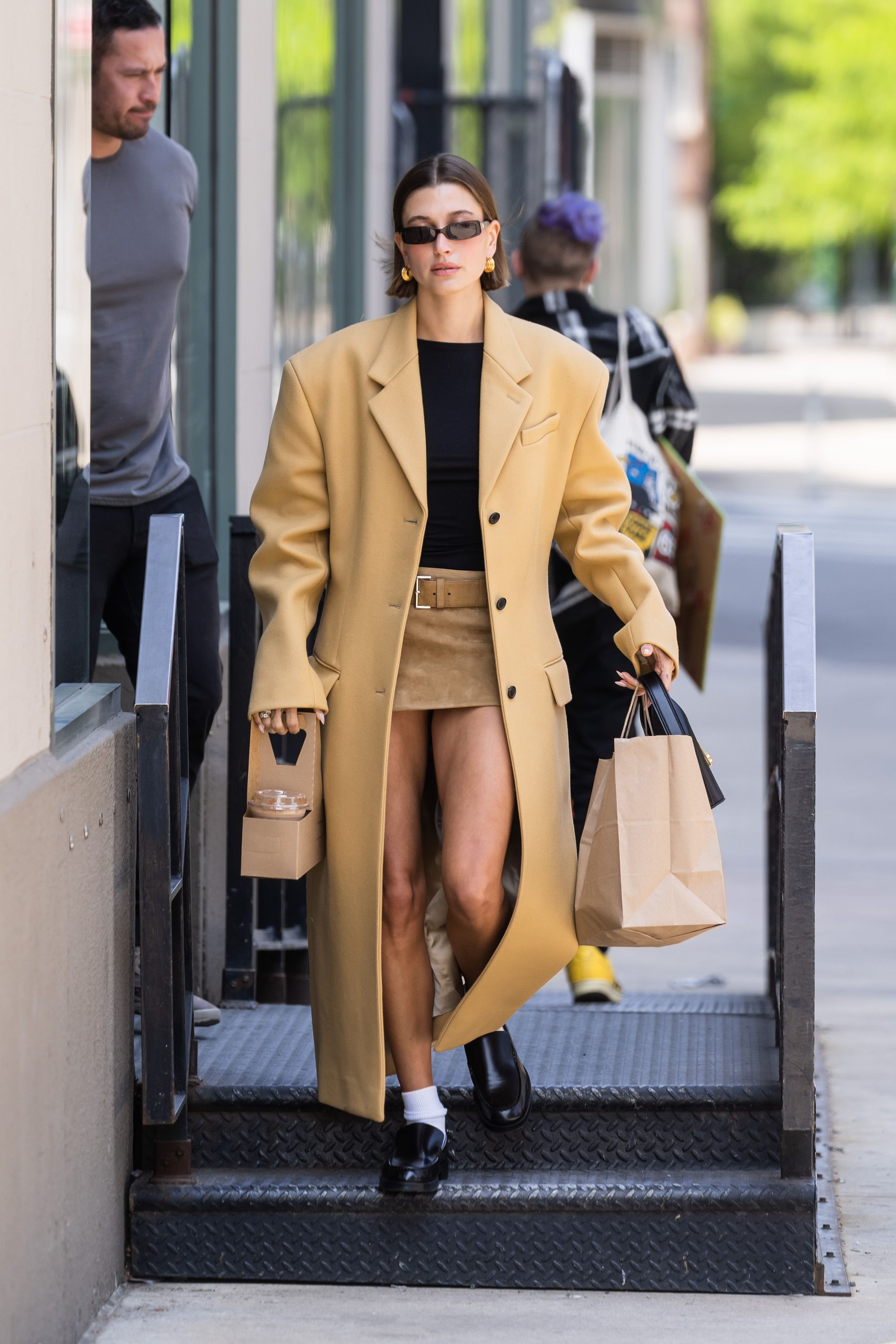 Hailey Bieber Wore an Open Blazer, Barely-There Bra, and Nikes in