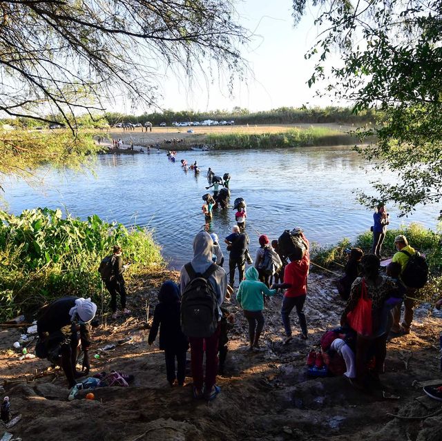 haitian migrants cross the rio grande river as seen from ciudad acuna, coahuila state, mexico, on september 23, 2021   tension reigns this thursday in a haitian migrant camp in ciudad acuña on the border with the united states, after the arrival of dozens of mexican police officers photo by pedro pardo  afp photo by pedro pardoafp via getty images