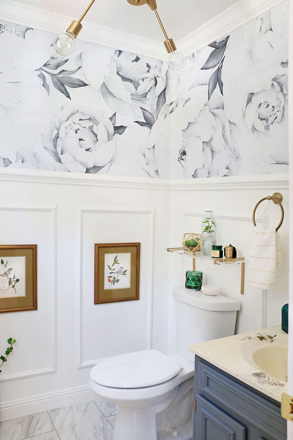 a bathroom with a white wallpaper
