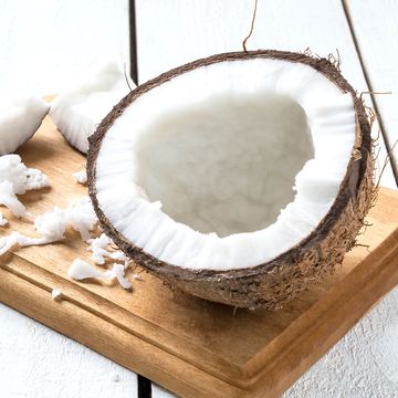 half coconut, pieces of pulp and fresh shavings