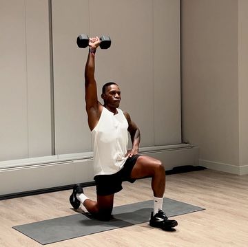 shoulder and arm workout,yusuf jeffers practicing half kneeling single arm arnold press exercise