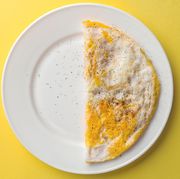 Half plate of crumbled egg plate on yellow background